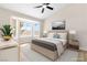 Cozy bedroom featuring a bay window, ceiling fan, and neutral décor at , Las Vegas, NV 89134