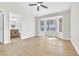 Bright bedroom featuring a bay window, hardwood floors, and an attached bathroom at , Las Vegas, NV 89134