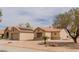 Single story house with tile roof and desert landscaping at , Las Vegas, NV 89134