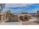 Charming single-story home featuring desert landscaping, tile roof, and attached two-car garage at , Las Vegas, NV 89134