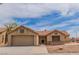 Single story home with tile roof, 2 car garage and desert landscaping at , Las Vegas, NV 89134