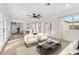 Open-concept living room with hardwood floors, lots of windows, and an attached dining area at , Las Vegas, NV 89134