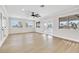 Spacious living room with large windows allowing plenty of natural light, and a ceiling fan at , Las Vegas, NV 89134