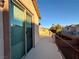 A spacious balcony offers outdoor living space and community views on a sunny day at 10145 White Mulberry Dr, Las Vegas, NV 89148