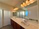 A spacious bathroom featuring a double vanity and large mirror for a luxurious feel at 10145 White Mulberry Dr, Las Vegas, NV 89148