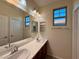 Bathroom with double sinks, vanity, and bright natural light at 10145 White Mulberry Dr, Las Vegas, NV 89148