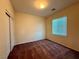 This bedroom has a window and closet with neutral paint and plush carpeting at 10145 White Mulberry Dr, Las Vegas, NV 89148