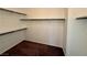 Spacious walk-in closet with ample shelving and carpeted floor at 10145 White Mulberry Dr, Las Vegas, NV 89148