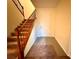 Inviting entryway with a tiled floor, staircase, and a bright white front door at 10145 White Mulberry Dr, Las Vegas, NV 89148