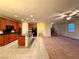 Open-concept kitchen with a central island, modern appliances, and seamless flow to the living area at 10145 White Mulberry Dr, Las Vegas, NV 89148