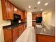 Well-equipped kitchen boasting granite counters, stainless steel appliances, and custom cabinetry at 10145 White Mulberry Dr, Las Vegas, NV 89148