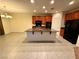 Modern kitchen with an island, granite countertops, and stainless steel appliances at 10145 White Mulberry Dr, Las Vegas, NV 89148