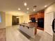 Stylish kitchen featuring an island, granite counters, and tile flooring at 10145 White Mulberry Dr, Las Vegas, NV 89148