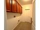 Laundry room with cabinets, tiled floor, and washer/dryer hookups at 10145 White Mulberry Dr, Las Vegas, NV 89148