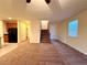 Open-concept living space with a staircase and views to the kitchen at 10145 White Mulberry Dr, Las Vegas, NV 89148