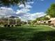 Wide view of the community park with grassy areas, landscaping, and shaded structure at 10145 White Mulberry Dr, Las Vegas, NV 89148