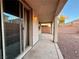 Covered patio overlooking a yard with desert landscaping and block wall at 10145 White Mulberry Dr, Las Vegas, NV 89148