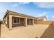Open backyard with covered patio and low-maintenance gravel landscaping, perfect for outdoor enjoyment at 10943 Doresta Ave, Las Vegas, NV 89166