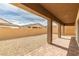 Backyard features an empty gravel area next to the covered patio at 10943 Doresta Ave, Las Vegas, NV 89166