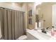 Bathroom featuring a single sink vanity, a toilet, and a shower with curtain rod at 10943 Doresta Ave, Las Vegas, NV 89166