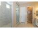 Bathroom featuring a glass shower with a tiled floor, a closed toilet and modern door at 10943 Doresta Ave, Las Vegas, NV 89166