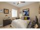 Bedroom with ceiling fan, and multiple framed pictures on the wall at 10943 Doresta Ave, Las Vegas, NV 89166