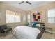 Bright bedroom featuring a modern ceiling fan, soft carpet, and neutral paint at 10943 Doresta Ave, Las Vegas, NV 89166
