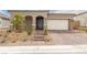 Charming single-story home with a brick driveway and well-maintained desert landscaping at 10943 Doresta Ave, Las Vegas, NV 89166