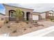 Beautiful front exterior with desert landscaping and charming architectural details at 10943 Doresta Ave, Las Vegas, NV 89166