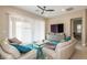 Cozy living room with plush seating, natural light, and contemporary decor at 10943 Doresta Ave, Las Vegas, NV 89166