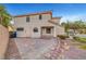 Backyard with stone pathway, privacy fence, and lush landscaping, showcasing the home's outdoor space at 10965 Ladyburn Ct, Las Vegas, NV 89141