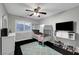 Bedroom featuring a bunk bed, ceiling fan, and a wall-mounted television at 10965 Ladyburn Ct, Las Vegas, NV 89141