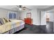 Bedroom with dark floors, gray walls, ceiling fan, window and dresser at 10965 Ladyburn Ct, Las Vegas, NV 89141