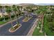 Aerial view of the community entrance showing lush landscaping and guarded gate at 10965 Ladyburn Ct, Las Vegas, NV 89141