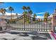 Wrought iron gate with automated pass-through into a secure community at 10965 Ladyburn Ct, Las Vegas, NV 89141