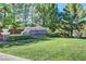 Landscaped community entrance with manicured lawn and stone sign, enhancing curb appeal at 10965 Ladyburn Ct, Las Vegas, NV 89141