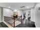Upstairs hallway with dark floors, white walls, and staircase at 10965 Ladyburn Ct, Las Vegas, NV 89141