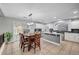 Eat-in kitchen with granite countertops, stainless steel appliances, and sliding glass doors leading to the pool at 10965 Ladyburn Ct, Las Vegas, NV 89141