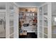 This walk-in pantry with glass french doors offers plenty of storage space for all your kitchen essentials at 10965 Ladyburn Ct, Las Vegas, NV 89141