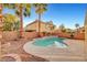 Relaxing backyard pool with a water fountain and well-manicured landscaping at 10965 Ladyburn Ct, Las Vegas, NV 89141