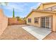Private backyard with a cozy concrete patio, perfect for outdoor seating and entertaining at 11016 Meadow Leaf Ave, Las Vegas, NV 89144
