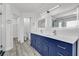 Bathroom featuring a double sink vanity with blue cabinets at 11016 Meadow Leaf Ave, Las Vegas, NV 89144