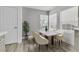 Dining room with neutral tones and a table set for four at 11016 Meadow Leaf Ave, Las Vegas, NV 89144