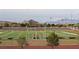 Scenic view of a well-maintained football field with goalposts and mountain backdrop at 11016 Meadow Leaf Ave, Las Vegas, NV 89144