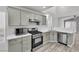Kitchen featuring modern appliances and light gray cabinets at 11016 Meadow Leaf Ave, Las Vegas, NV 89144