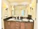 Bathroom features double sinks, large mirror, and custom wood cabinets at 135 E Harmon Ave # 2916, Las Vegas, NV 89109