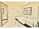 This bathroom features a large soaking tub with jets and a tiled surround at 135 E Harmon Ave # 2916, Las Vegas, NV 89109