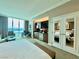 Open concept bedroom featuring a kitchenette, sitting area, and an amazing window view at 135 E Harmon Ave # 2916, Las Vegas, NV 89109