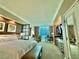 Well-appointed bedroom with king bed, seating area, workspace, and kitchenette at 135 E Harmon Ave # 2916, Las Vegas, NV 89109