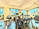 Spacious gym featuring lots of exercise equipment and natural light through large windows at 135 E Harmon Ave # 2916, Las Vegas, NV 89109